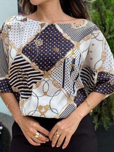 BLUSA ESCOTE OJAL SILUETA AMPLIA