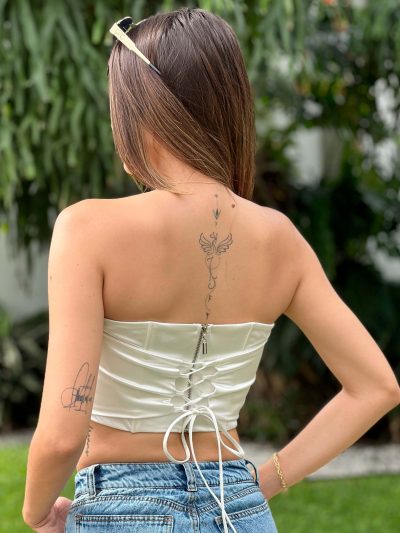 Crop top estraple con base en punta con barilla en cortes